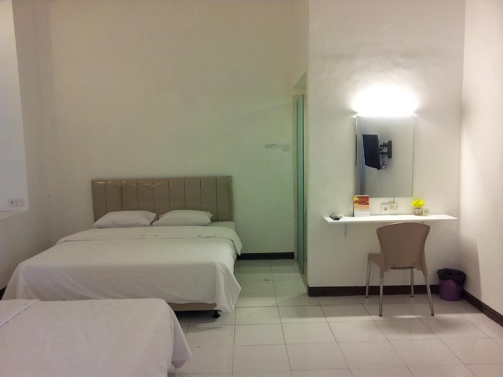 Loxy Inn Surabaya Zimmer foto